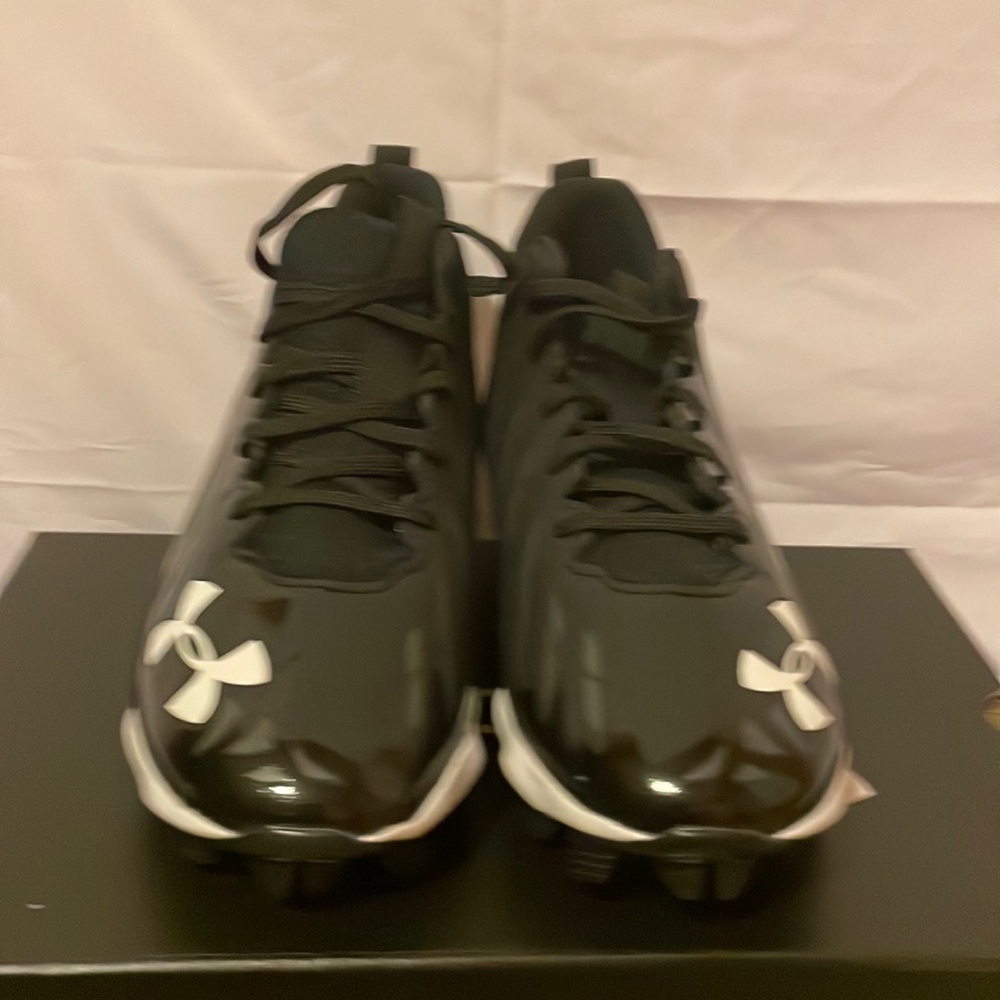 Black Under Armour football cleats.